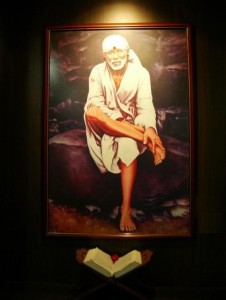 Sai Baba sitting on Stone picture 